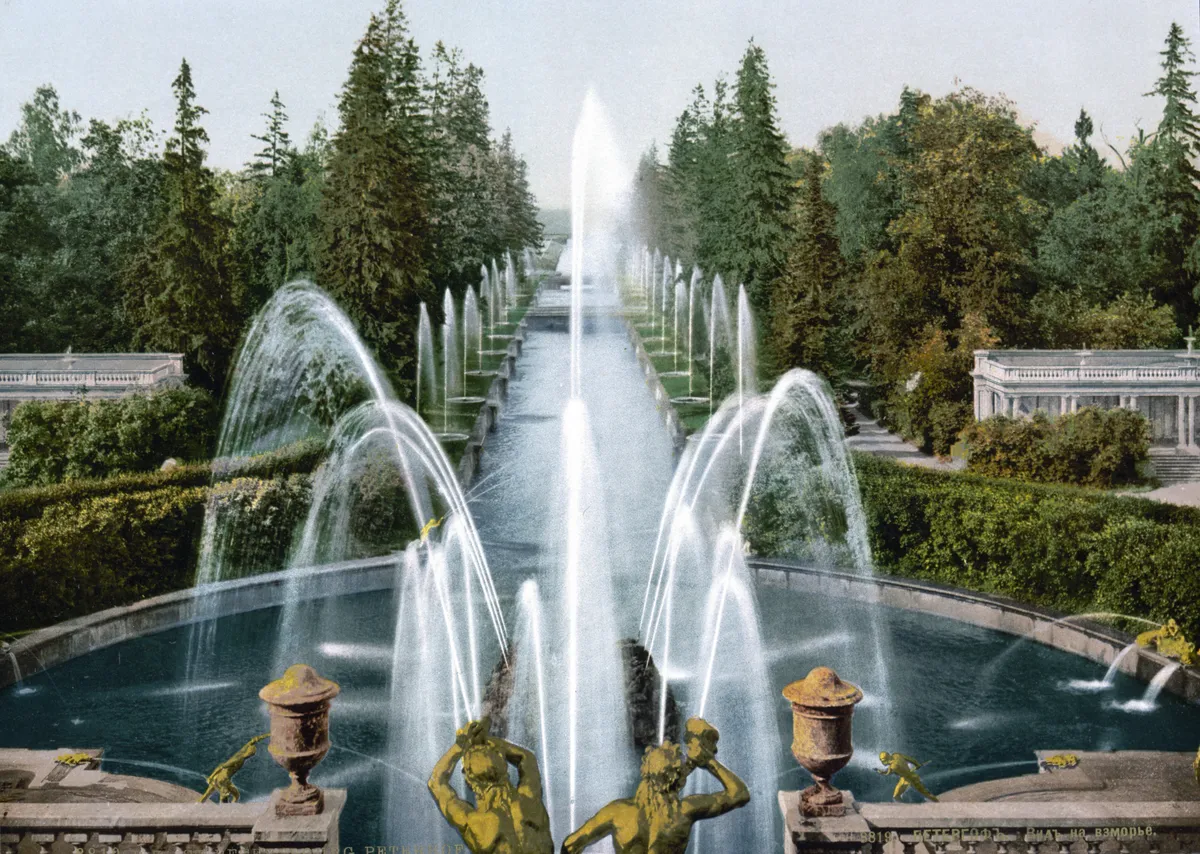 The Grand Cascade at Peterhof: gilded statues and fountains stepping down from the palace to the canal, in photochrom color.