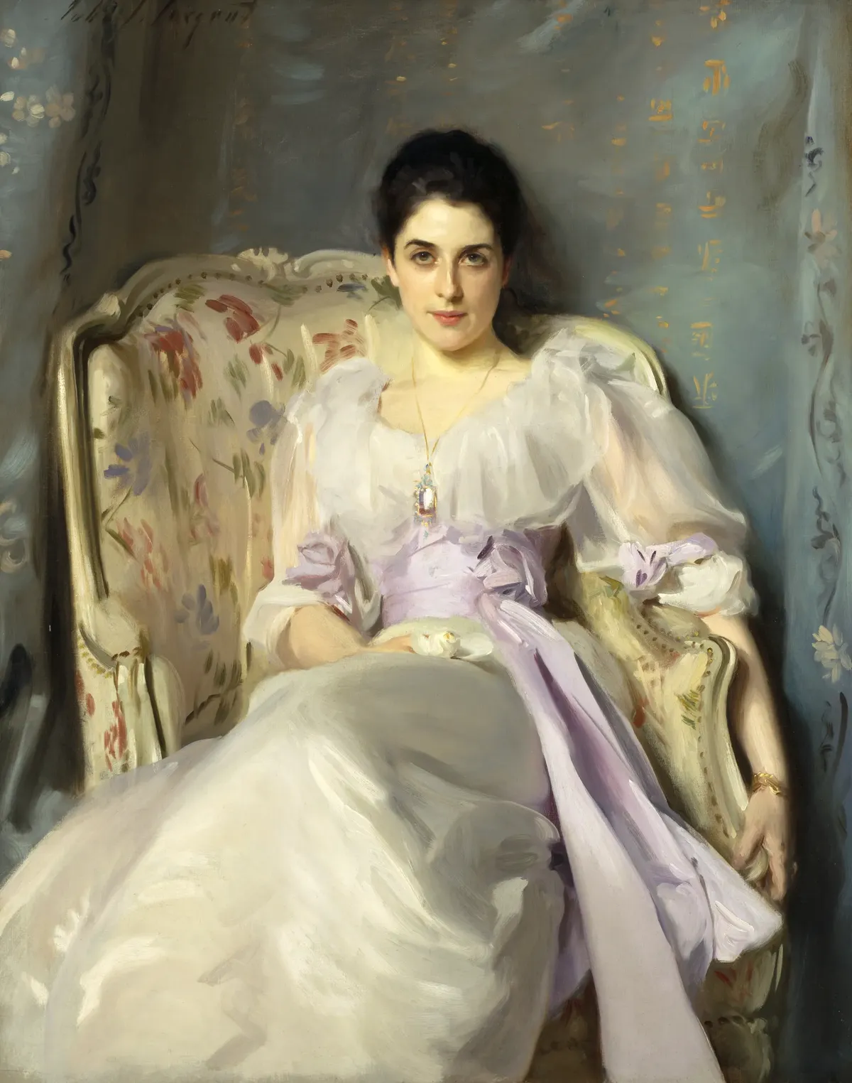 A woman in a white silk dress with a lilac sash, seated in an armchair and looking directly out of the painting.
