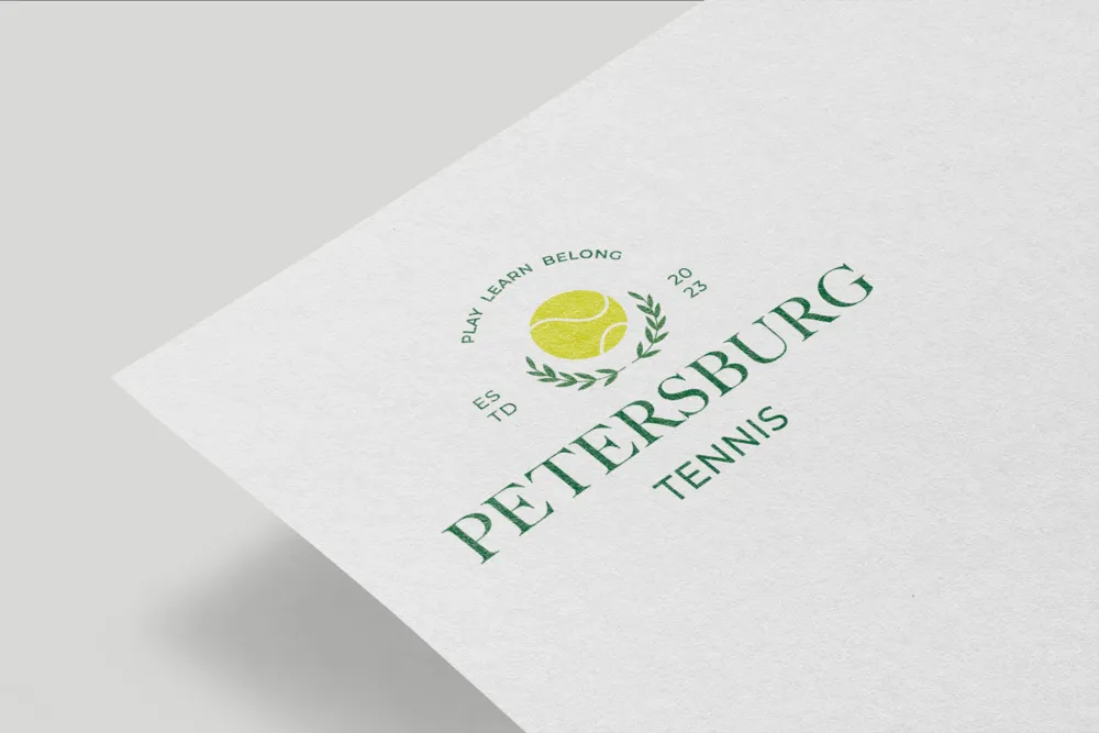 The Petersburg Tennis Academy crest printed on textured paper.