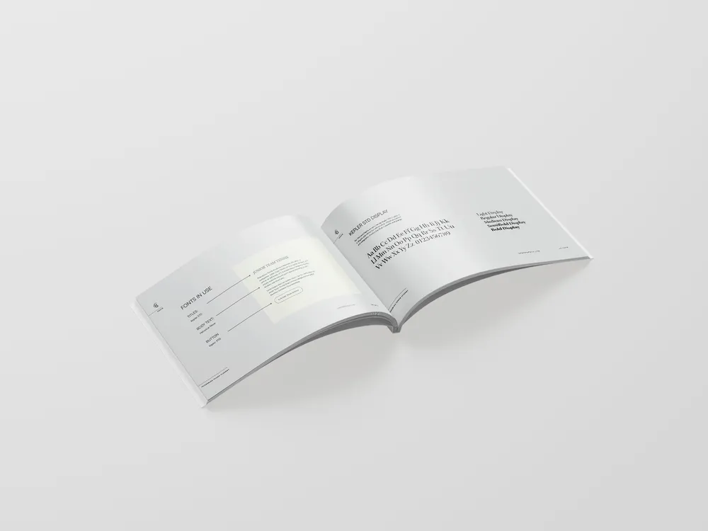 An open brand book showing the academy’s typography pages.